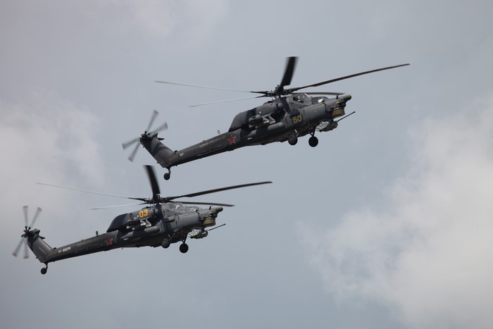 Two Russian Mi-28 attack helicopters in flight