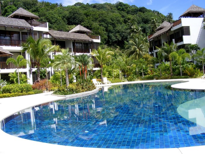 Resort with swimming pool and tropical vegetation
