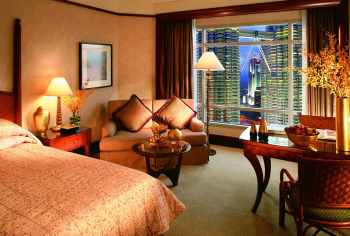 Luxury hotel room with city view at night