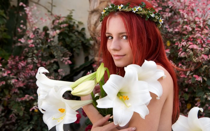 Redhead girl with white lilies and flower crown