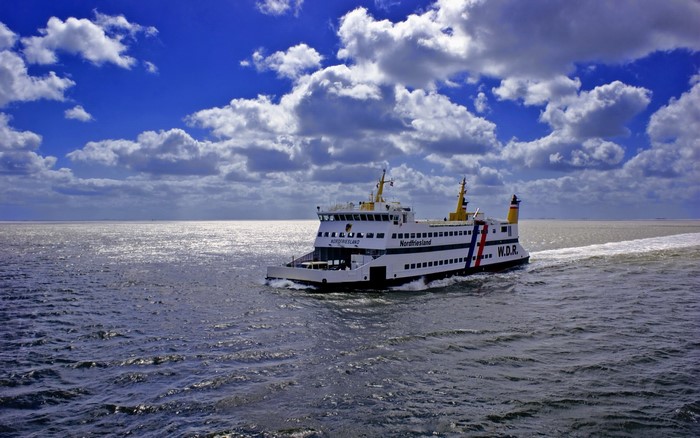 Ferryboat Nordfriesland sailing on the sea under clouds
