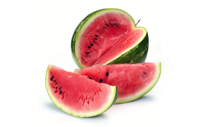 Watermelon slices and a whole watermelon