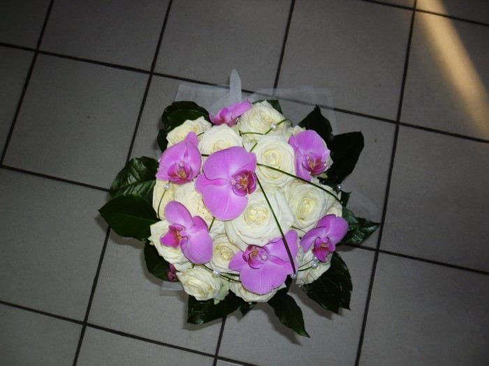 Bouquet of white roses and pink orchids