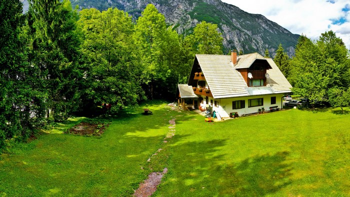 House in Bohinj, Slovenia with mountain backdrop