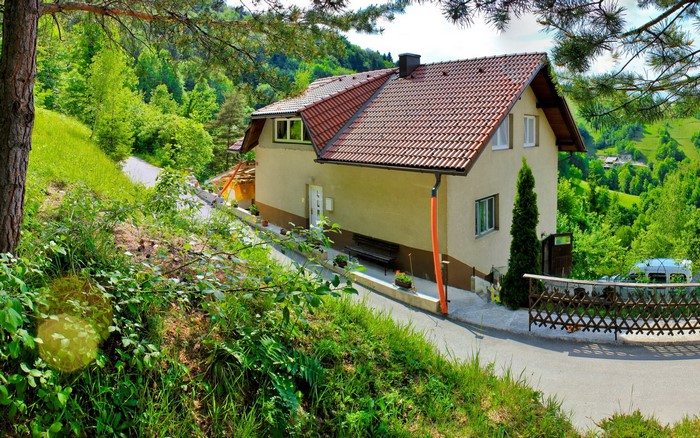 House in a green Slovenian landscape