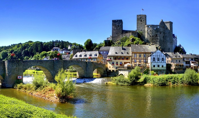 Castle and bridge over a river in Germany
