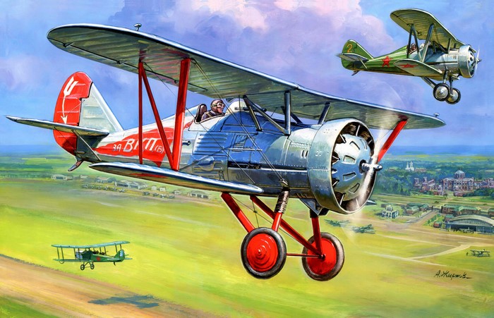 Biplane Aircraft in Flight Over Rural Landscape