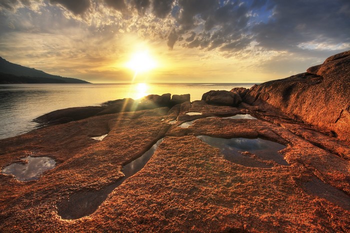 Sunset over rocky coast in Freycinet National Park, Tasmania