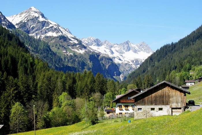 Alpine village with snow-capped mountains in Austria