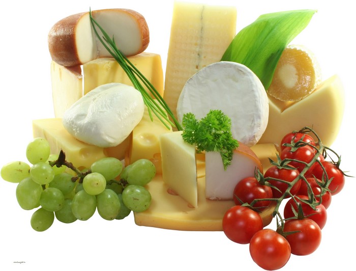 Assortment of cheeses with grapes and tomatoes
