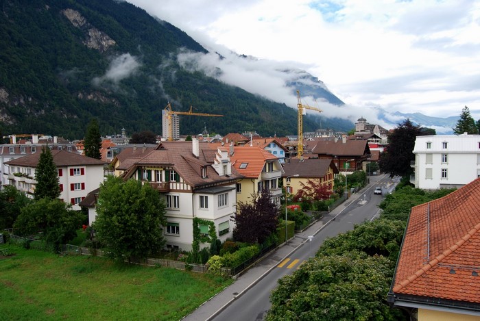 Town with mountains and cranes in Interlaken, Switzerland