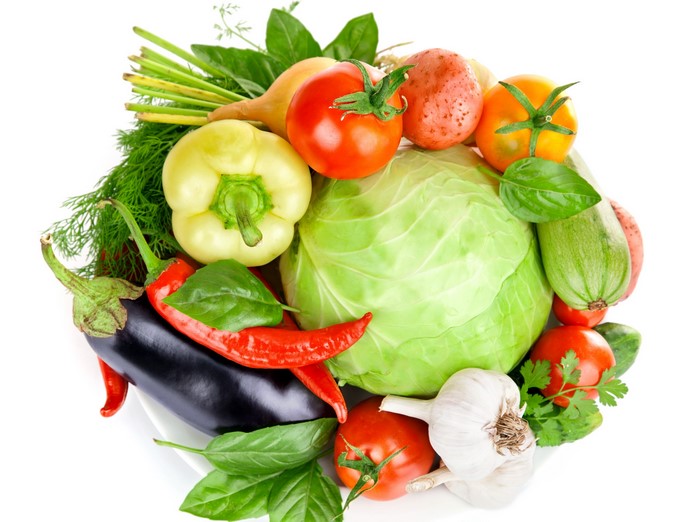 Assortment of fresh vegetables on a white plate
