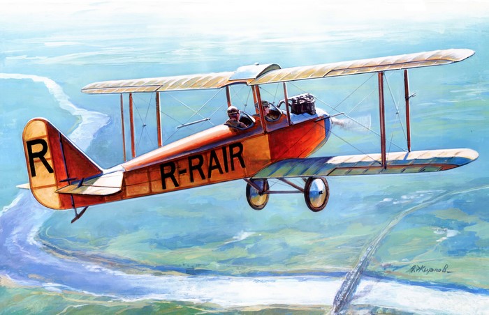 Biplane R-RAIR in flight over a river