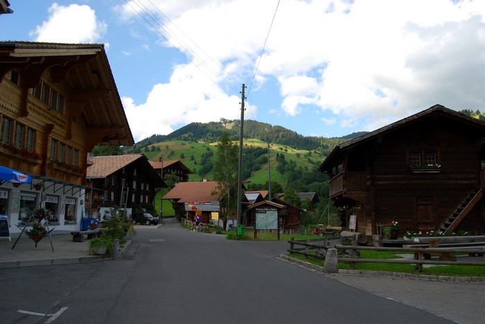 Habkern, Switzerland village street with wooden houses and mountains