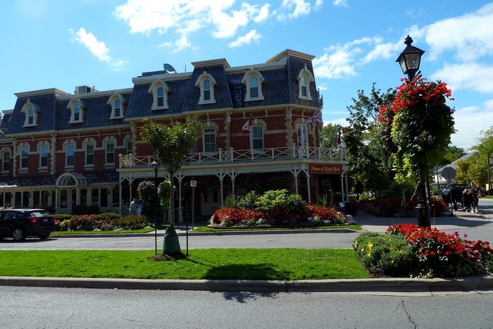 Prince of Wales Hotel building with flowers and trees