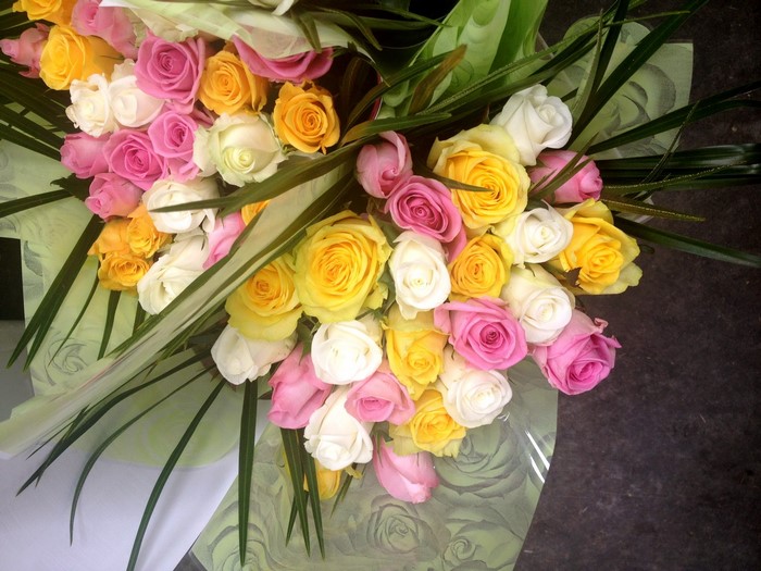 Bouquet of pink, yellow, and white roses