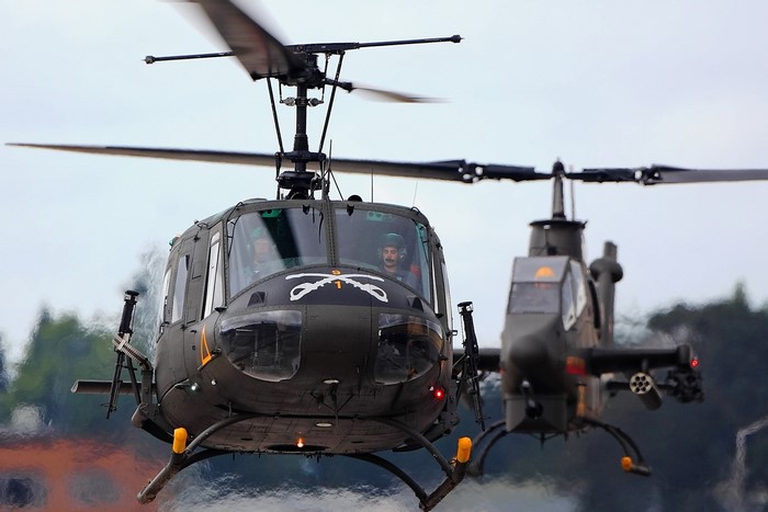 Two military helicopters in flight