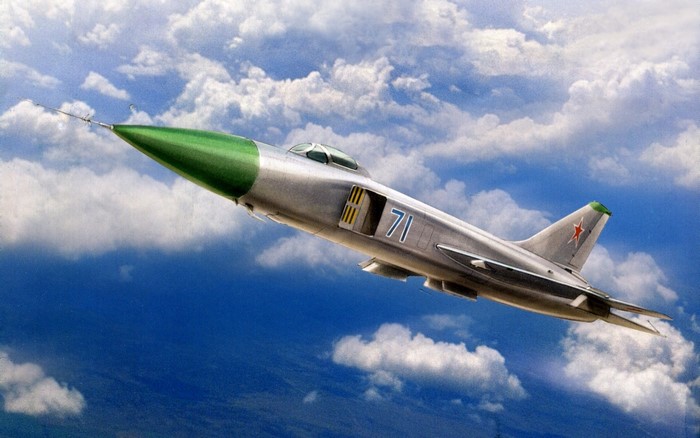 Soviet fighter jet with green nose flying in clouds