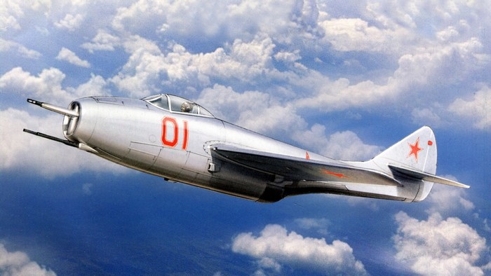 Silver Soviet MiG-15 Fighter Jet in Flight
