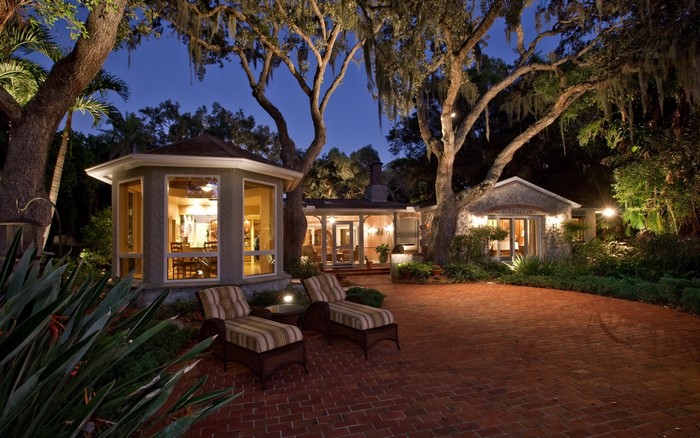 House with patio and trees at night in Sarasota, Florida