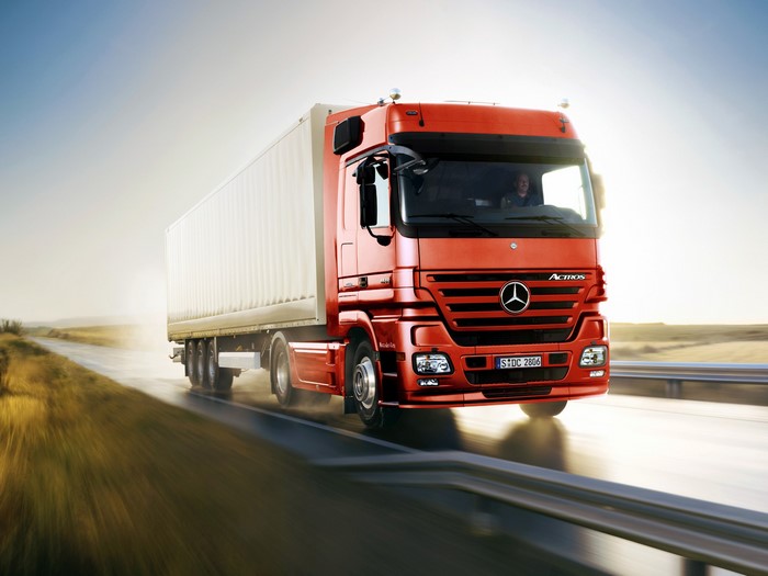 Red Mercedes-Benz Actros Truck on a Highway