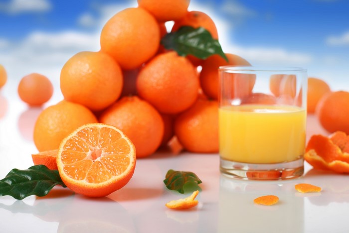 Oranges and orange juice in a glass