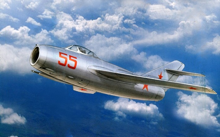 Painting of a silver Soviet MiG-15 fighter jet in flight