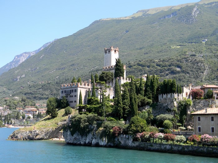 Castle of Malcesine on a rocky outcrop by the water in Italy
