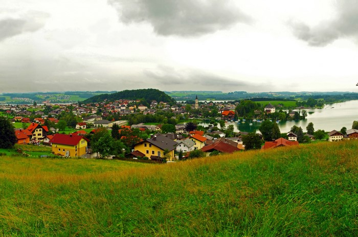 Village on a lake in Austria under cloudy sky