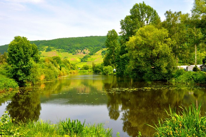 Lake in Germany with rolling hills and trees