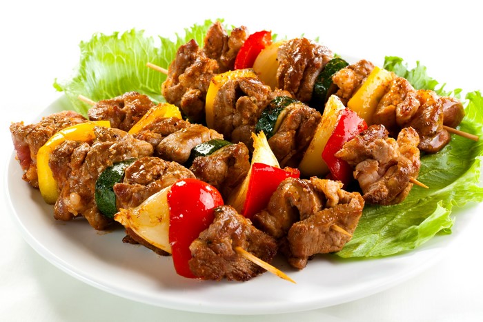Meat and vegetable skewers on a plate