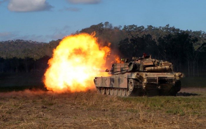 M1 Abrams tank firing a large explosion
