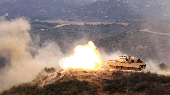 M1 Abrams Tank Firing in Hilly Terrain
