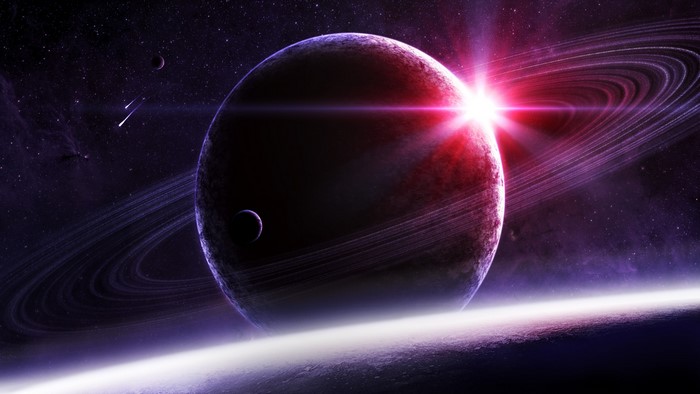 Planet with rings and moons in space