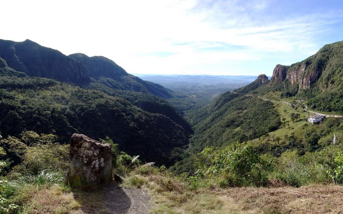 Mountains and valley with a road and building