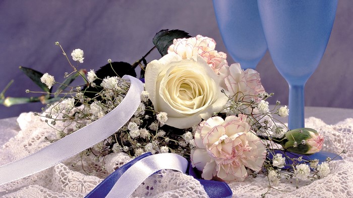 Bouquet with white rose and blue glasses