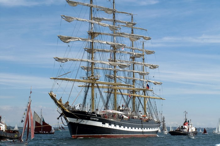 Kruzenstern tall ship sailing with other boats