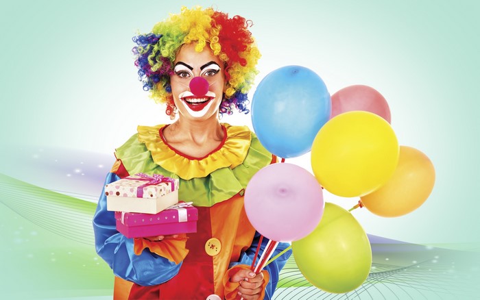 Clown holding gifts and balloons
