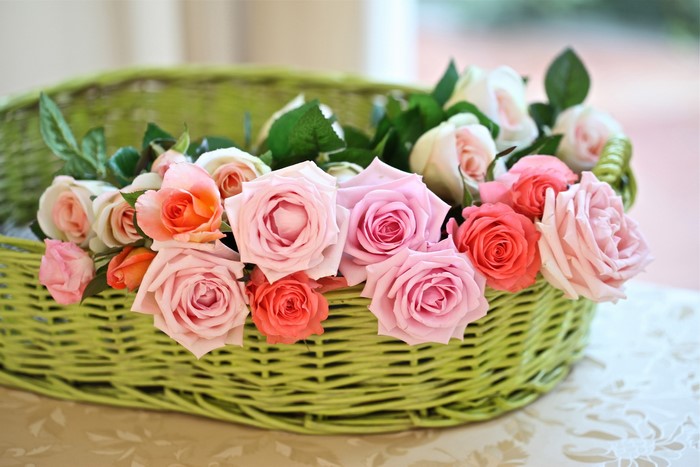 A basket of pink and orange roses