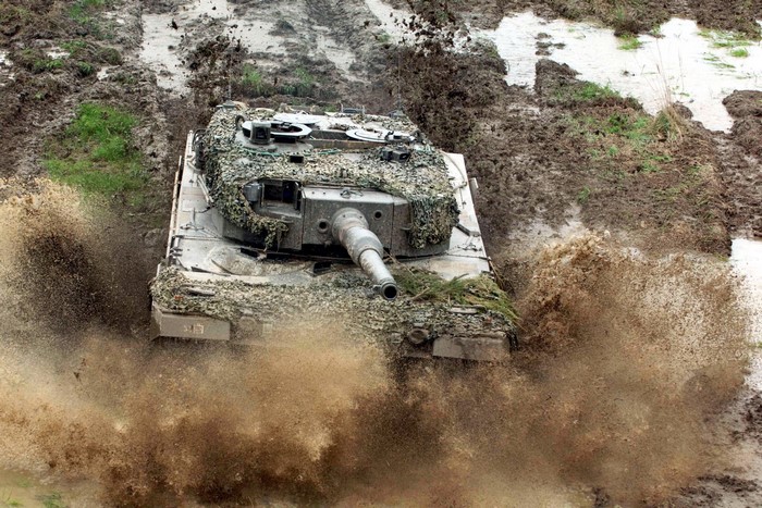 Tank driving through mud and water