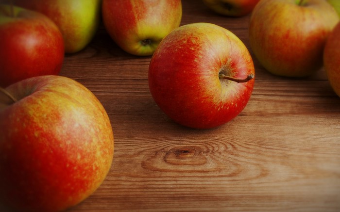 Apples on a wooden table