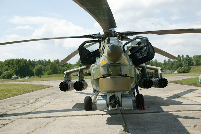 Military helicopter with open doors and weapons