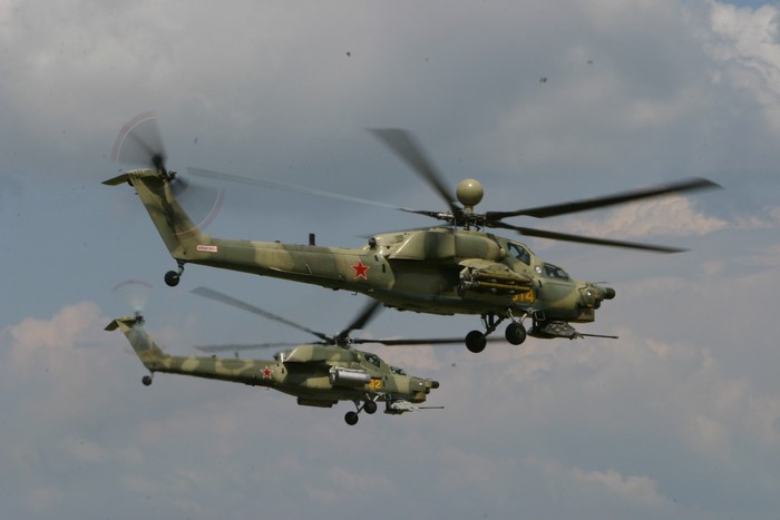 Two Russian Mi-28 attack helicopters in flight