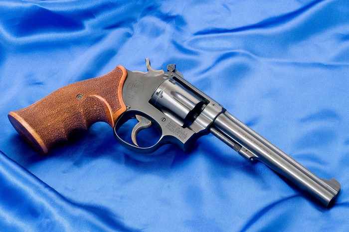 Smith & Wesson K22 Revolver on Blue Fabric