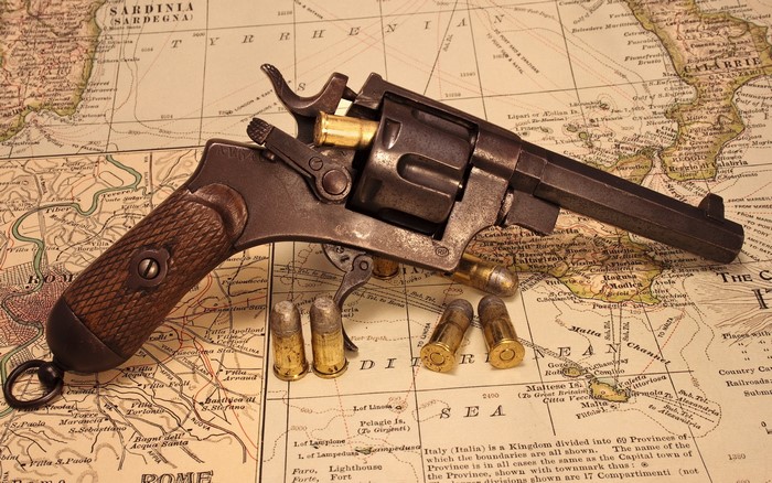Antique Revolver and Ammunition on Map