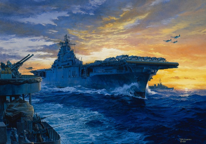 Aircraft carrier and ships at sea during sunset