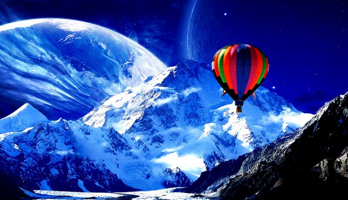 Hot air balloon over snowy mountains with planets