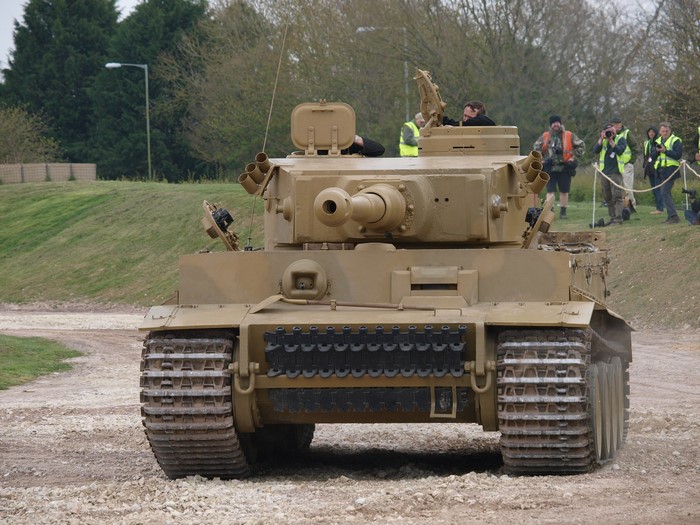 Tiger tank on a gravel path with spectators