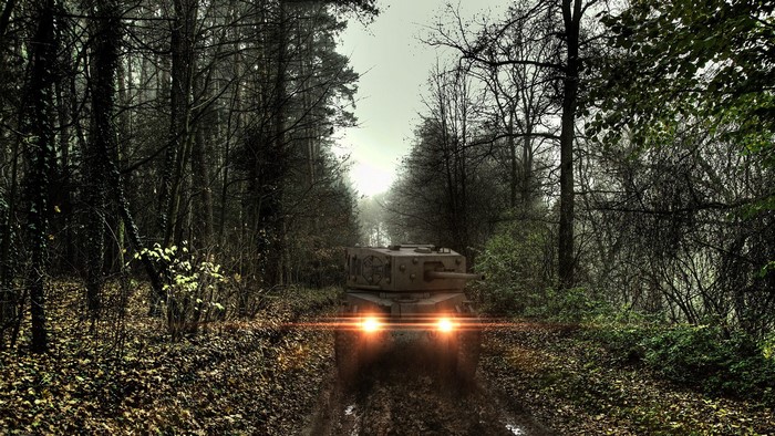 Tank in a foggy forest road