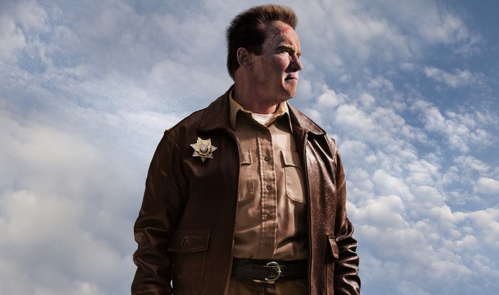 Arnold Schwarzenegger as Sheriff in front of clouds
